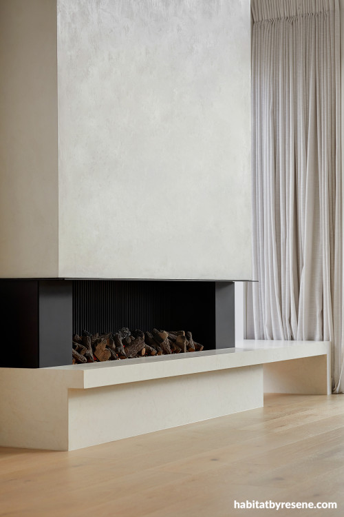 Fireplace featuring textured surround