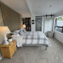 Bedroom with feature wall in Resene Half Pravda and timber slat headboard