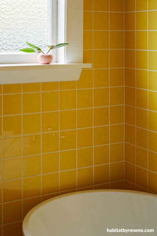 Bathroom featuring yellow tiles and trims painted in Resene Miso