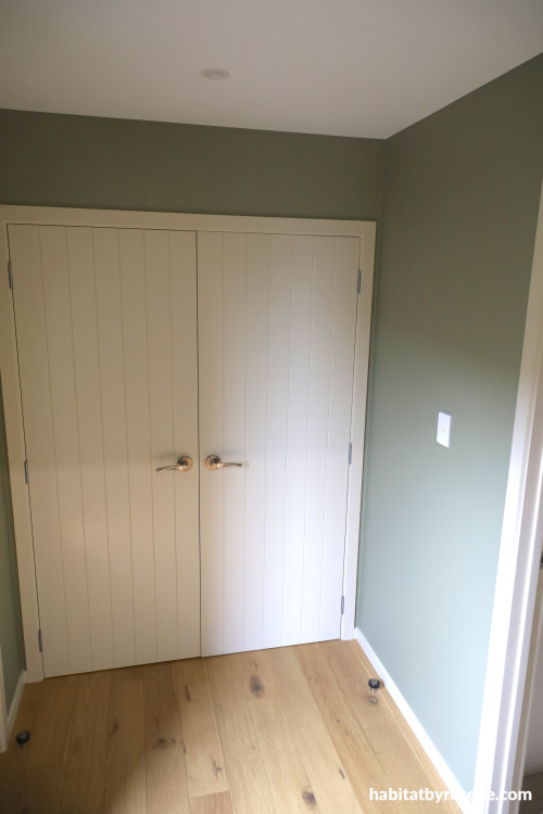 Entrance foyer Resene Bitter, trims and doors in Fossil and ceiling in Alabaster. 