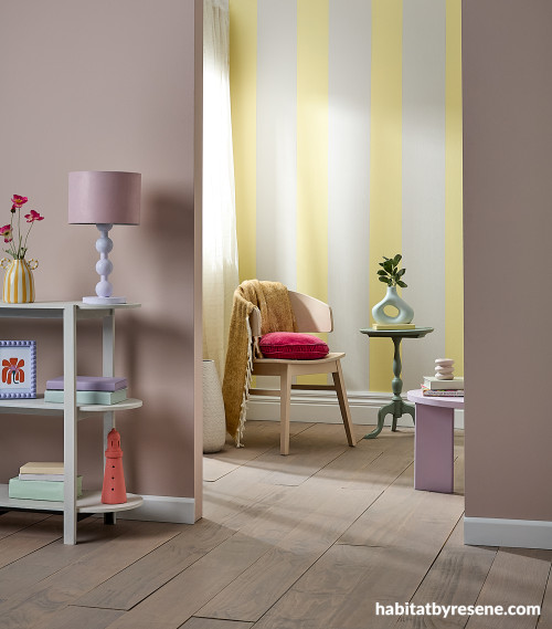 Living area and sunroom featuring painted striped walls