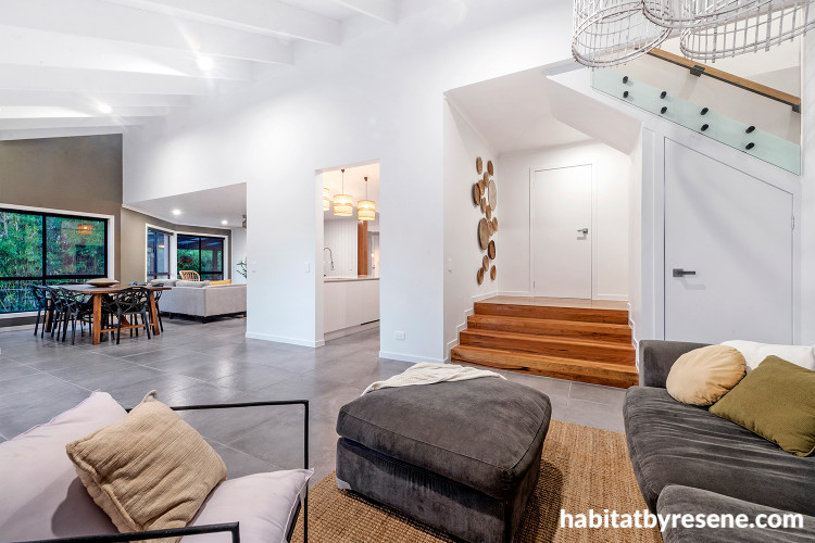 Living and dining area with feature wall in Resene Triple Friar Greystone and walls in Half Alabaster