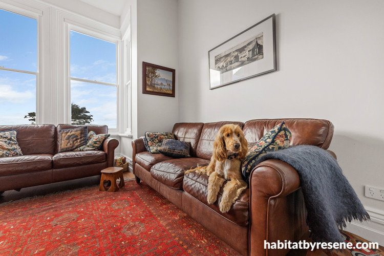 Living area featuring classic whites such as Resene Half Merino and large windows