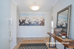 Entryway painted in light mother of pearl beige Resene Quarter Sandspit Brown