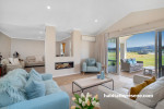 Living room featuring light beige walls painted in Resene Quarter Sandspit Brown and ceiling and trims in Resene Alabaster