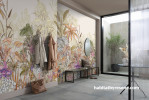 Entranceway featuring a nature mural-inspired wallpaper