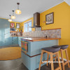 Kitchen featuring Spanish-inspired hues including Resene Bright Spark