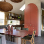 Kitchen and dining area painted in Resene Bullwhip and Resene Quarter Thorndon Cream