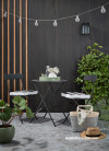 Outdoor porch with dark wood stain wall and battens