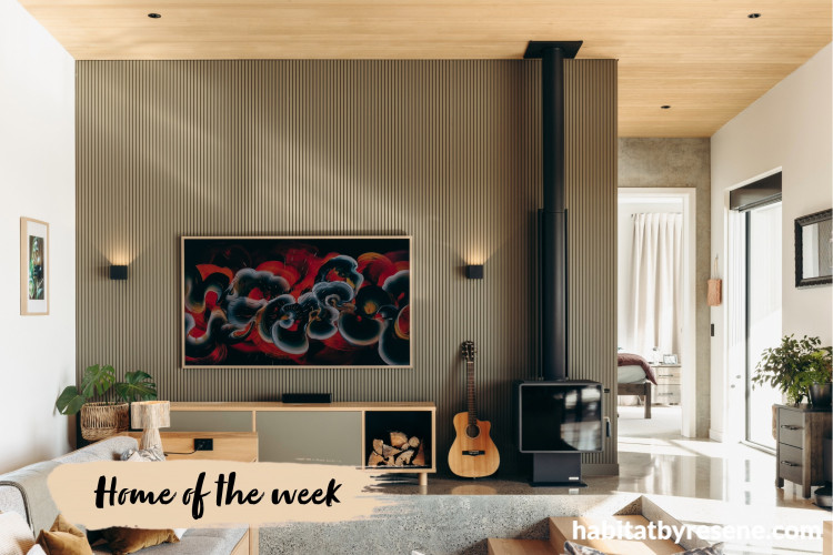 Living room featuring stone coloured wall panels complemented by crisp white walls